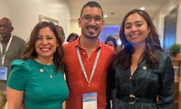 Brian Romero, center, stands with his former boss Assembly Member Jessica González-Rojas, left, and his current boss state Sen. Kristen Gonzalez.