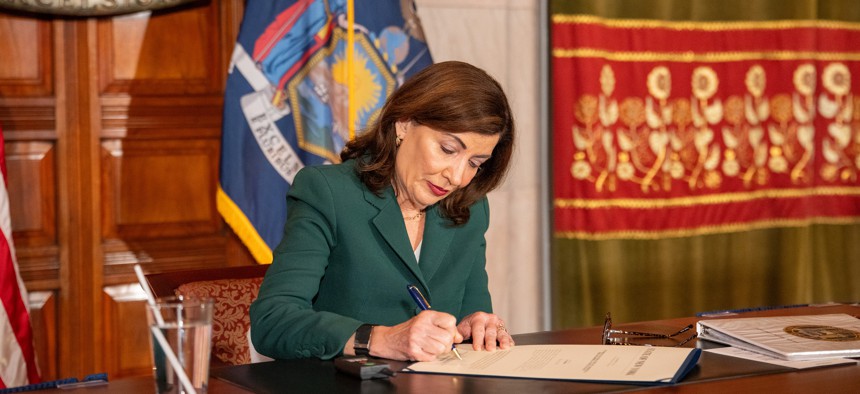 Gov. Kathy Hochul signs a bill into law on June 27, 2025.