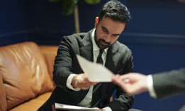 Democratic mayoral nominee Zohran Mamdani looks over his notes before the first general election mayoral debate on Oct. 16, 2025.