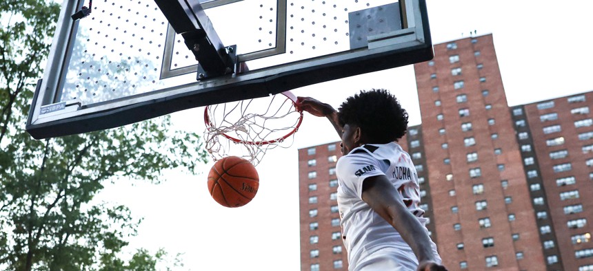 Jaxon Richardson dunks the ball during the SLAM Summer Classic at Rucker Park on Aug. 18, 2025.