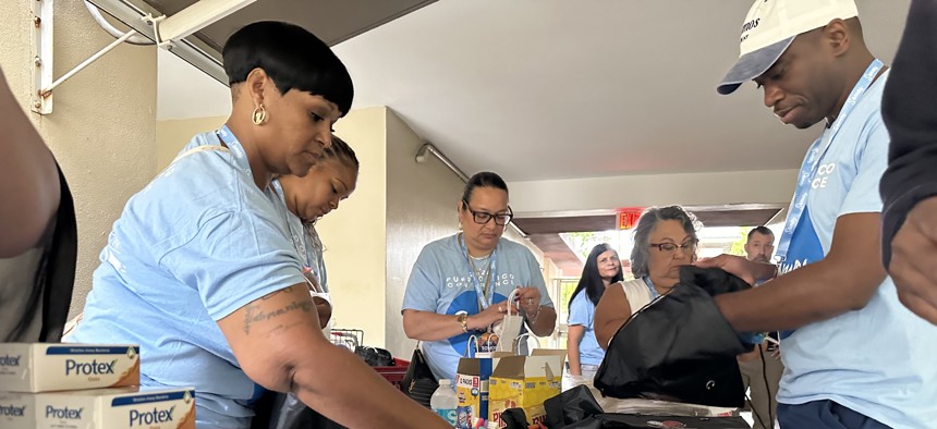 Somos attendees prepare care packages for residents at a struggling nonprofit assisted living residence in Carolina, Puerto Rico, during last year’s day of service.