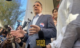 Former Gov. Andrew Cuomo talks to press after casting his vote.