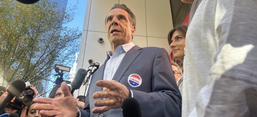Former Gov. Andrew Cuomo talks to press after casting his vote.