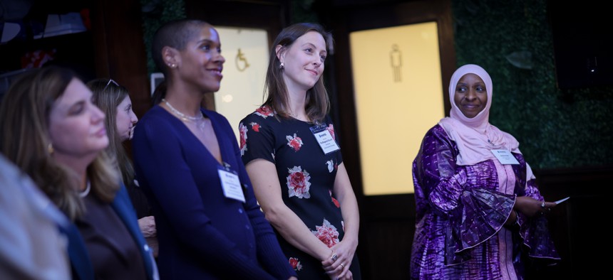 Cathleen McCadden Benjamin, center left, and Elle Bisgaard-Church, center right.