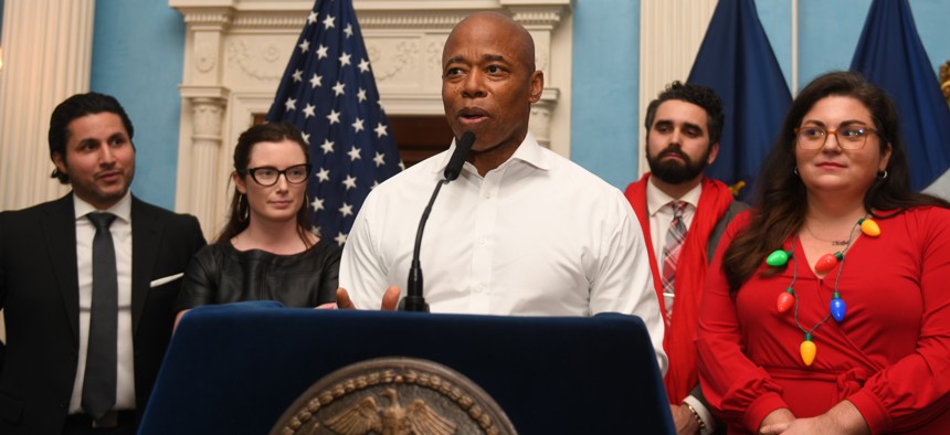 New York City Mayor Eric Adams speaks at a 2022 holiday reception for reporters.