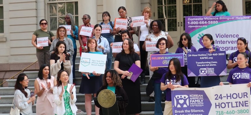New York City Council members and nonprofits that provide services to survivors of gender-based violence rally outside City Hall in June 2025.