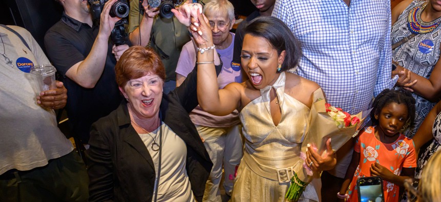 Albany Mayor Kathy Sheehan, left, celebrates with her successor Dorcey Applyrs.