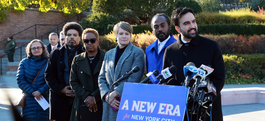 Mayor-elect Zohran Mamdani appears with transition committee members on Nov. 24. From left: Taxi Workers Alliance President Bhairavi Desai, Darrick Hamilton of The New School, Tara Gardner of the Daycare Council of NY, Open New York Executive Director Annemarie Gray Brooklyn Children’s Museum Executive Director Atiba Edwards and Mamdani.