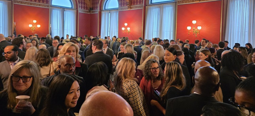 State lawmakers attend Assembly Speaker Carl Heastie’s morning reception in the Capitol on the first day of the legislative session.