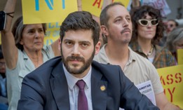 Assembly Member Alex Bores, seen here protesting federal immigration enforcement in Manhattan on Sept. 18, 2025, has seen his congressional campaign targeted by a pro-AI super PAC.