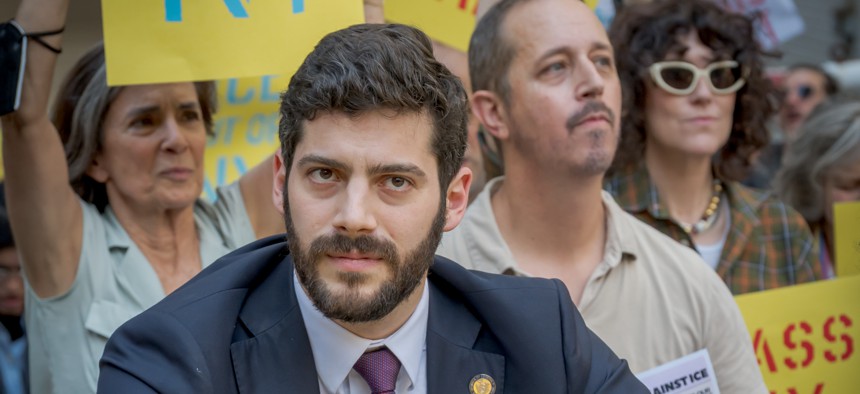 Assembly Member Alex Bores, seen here protesting federal immigration enforcement in Manhattan on Sept. 18, 2025, has seen his congressional campaign targeted by a pro-AI super PAC.