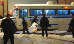 Police loaded protesters into a bus on Tuesday night.