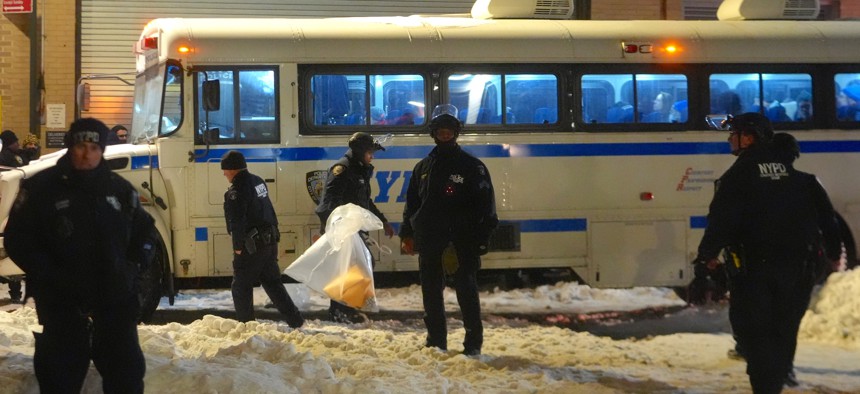 Police loaded protesters into a bus on Tuesday night.