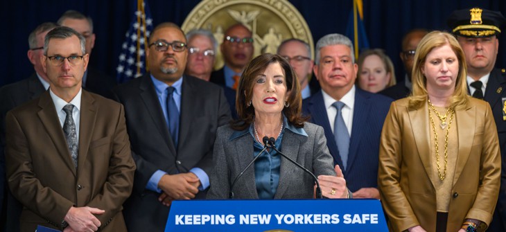 Flanked by law enforcement officials, Gov. Kathy Hochul announces her proposal for a statewide ban on cooperation agreements between local law enforcement and ICE.