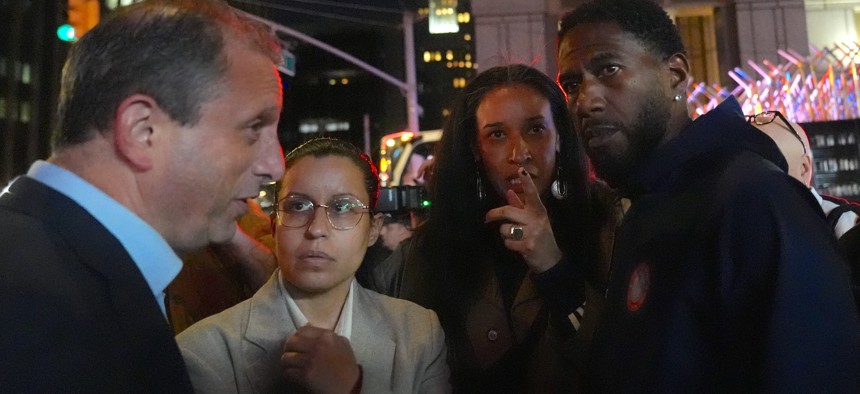 Council Members Tiffany Cabán and Sandy Nurse join a protest after ICE raids on Canal Street in October. They spoke with then-Comptroller Brad Lander, left, and Public Advocate Jumaane Williams, right.