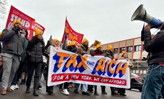 Demonstrators march to the state Capitol to pressure Gov. Kathy Hochul to tax the rich on Feb. 25, 2026.