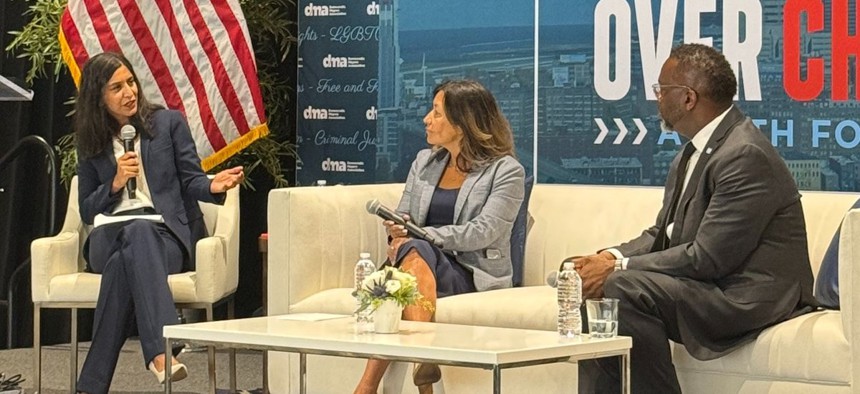 Insha Rahman, left, moderates a panel featuring former Kamala Harris 2024 Campaign Manager Julie Chavez Rodriguez and Chicago Mayor Brandon Johnson at the Democratic Mayors Association summit in Cleveland.