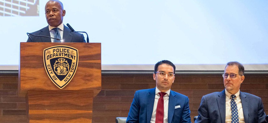 Former Department of Buildings Commissioner Eric Ulrich, center, joins then-Mayor Eric Adams, left, for an announcement in September 2022.