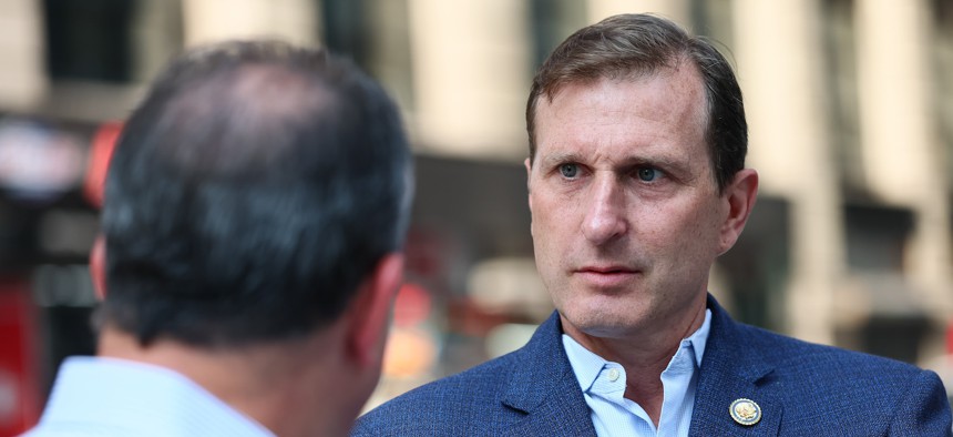 Rep. Dan Goldman, right, and then-Comptroller Brad Lander touch base outside 26 Federal Plaza in August.