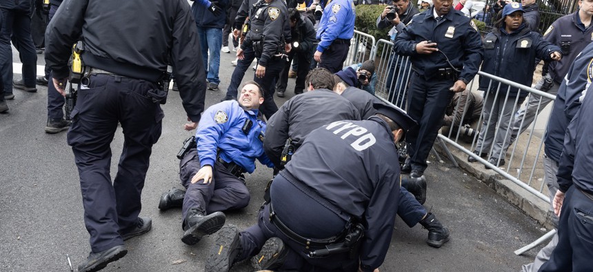 Police arrest a person suspected of throwing what looked like an explosive device near Gracie Mansion Saturday. There were no injuries.