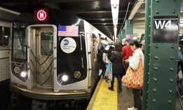 Riders board an M subway train in Manhattan, navigating just one part of a larger end‑to‑end journey.