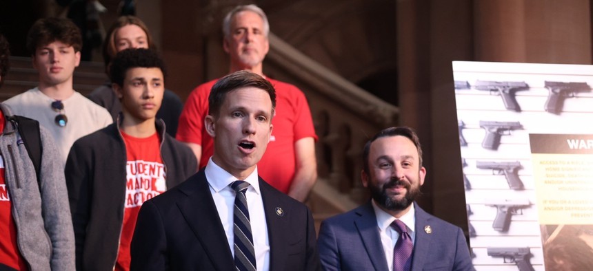 State Sen. Erik Bottcher and Assembly Member Keith Powers discuss the bill with gun safety advocates on March 10, 2026.