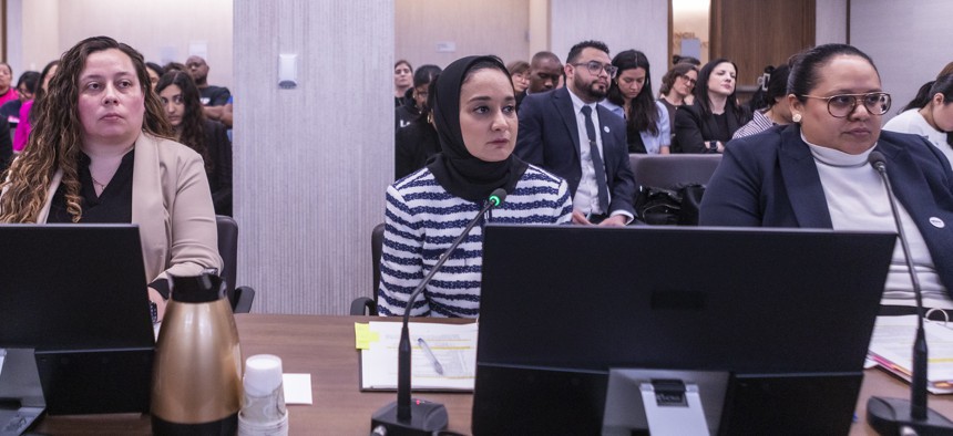 MOIA Commissioner Faiza Ali, center, previously worked for the council.