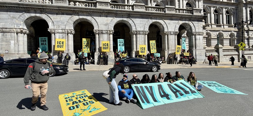 Lawmakers hold a sit-in outside the state Capitol in support of the New York for All Act on March 24, 2026.