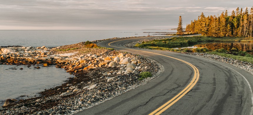 A picturesque winding road in Maine.