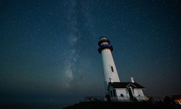 The Milky Way galaxy is seen stretching across the night sky above the Pigeon Point Lighthouse in Pescadero, California, United States, on October 20, 2025.