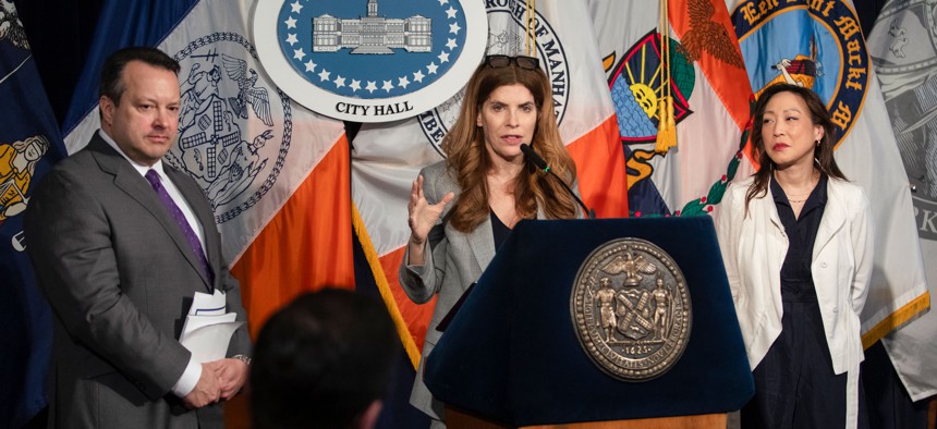 From left, council budget director Nathan Toth, Speaker Julie Menin and Finance Committee Chair Linda Lee