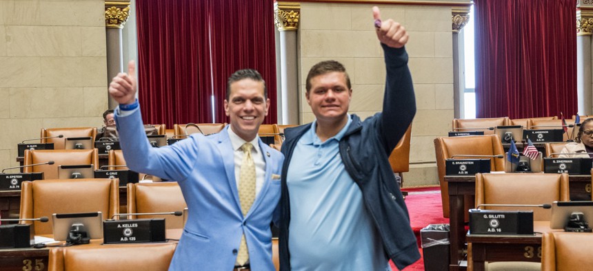 Assembly Member Angelo Santabarbara, left, and his son Michael, who suffers from autism, pose together in the Assembly chamber.