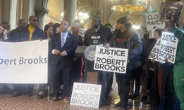 Assembly Member Erik Dilan and activists rally for prison reform on Jan. 27, 2025.