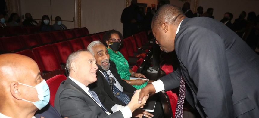Comptroller Tom DiNapoli shaking hands with then-Comptroller Brian Benjamin in 2021.