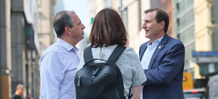 Brad Lander speaks with Rep. Dan Goldman outside 26 Federal Plaza in August.