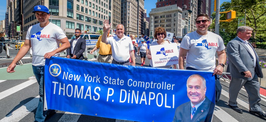 Comptroller Tom DiNapoli signs state workers' checks. Now they're returning the favor. 