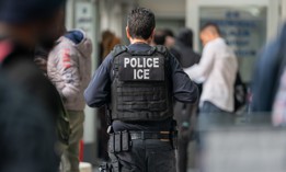 A federal immigration agent is seen at 26 Federal Plaza on June 6, 2023.