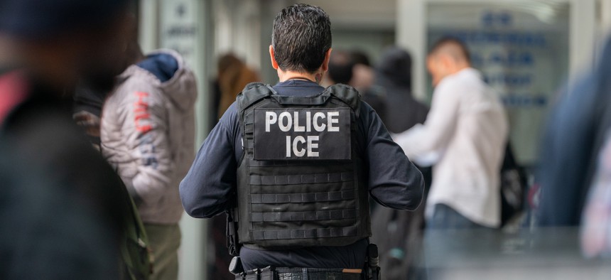 A federal immigration agent is seen at 26 Federal Plaza on June 6, 2023.