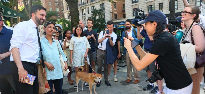 Zohran Mamdani greets voters on primary election day in 2025.