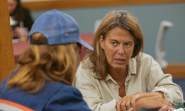NYC HPD Commissioner Dina Levy hears from a tenant at one of Mayor Zohran Mamdani's Rental Ripoff Hearings at Fordham University in the Bronx.