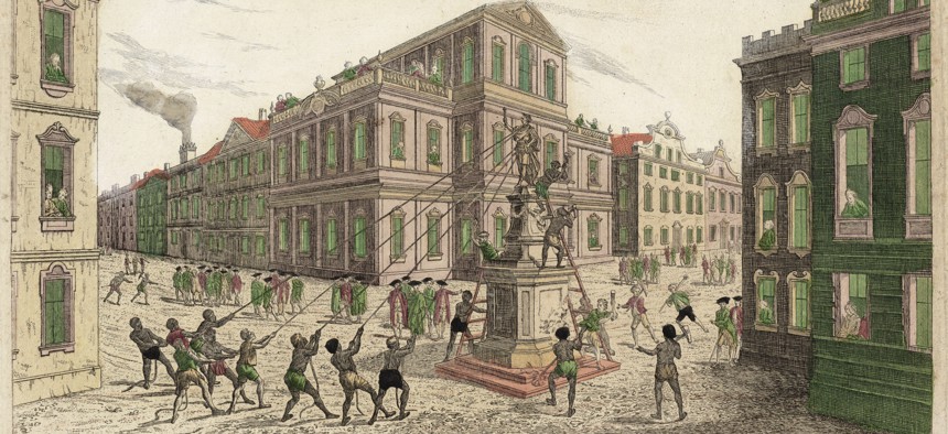 A crowd pulls down a statue of King George III in Bowling Green.