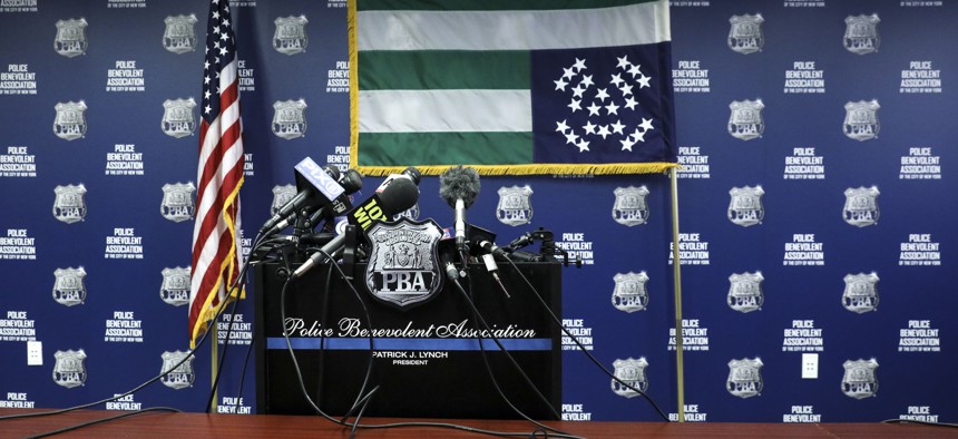 The Police Benevolent Association displays the NYPD flag upside down in protest of the termination of Officer Daniel Pantaleo, who choked Eric Garner to death, on Aug. 19, 2019.