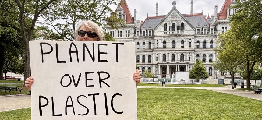 This climate advocate was one of dozens to rally in West Capitol Park on Monday in support of the bill to limit plastic packaging on products in the state.