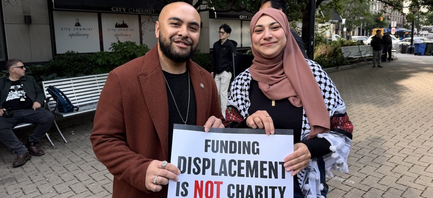 Assembly Member Steven Raga and rival state Senate candidate Aber Kawas pose together following a press conference for the Not on Our Dime! Act on May 22, 2026.