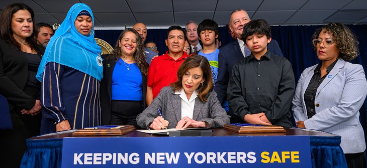 Gov. Kathy Hochul ceremonially signs a budget bill expanding immigrant protections and limits cooperation with ICE on May 29.