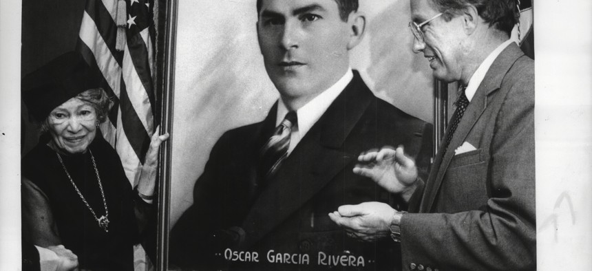 A portrait of the late Assembly Member Oscar Garcia Rivera, a proud socialist and the first Puerto Rican to serve in the state Legislature, is unveiled by his widow Dr. Eloise Rivera and Lieutenant Governor Stan Lundeen on Sept. 14, 1987.