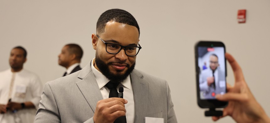 Troy Grant films a video at the New York State Fatherhood Convening