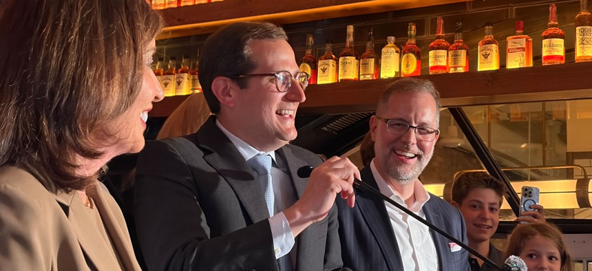 Micah Lasher celebrated the win flanked by his former boss, Gov. Kathy Hochul and his ally, Comptroller Mark Levine.