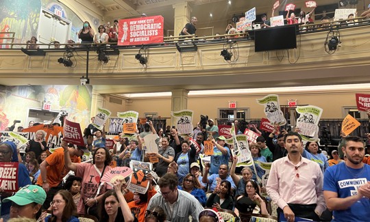 A room packed with housing advocates. 