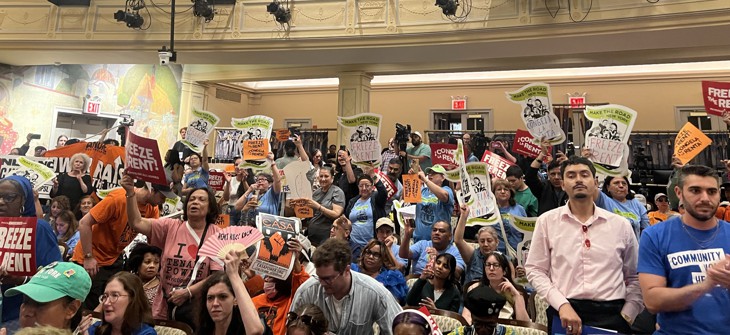 A room packed with housing advocates. 
